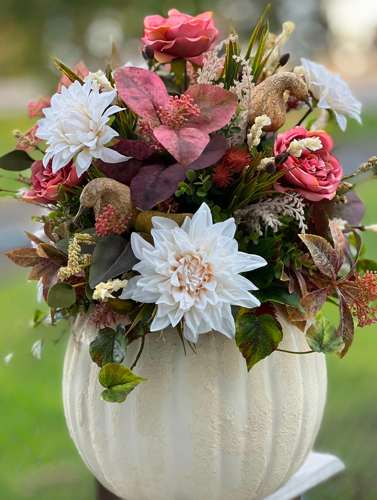 Fine Grass Bush | Yellow Green used in a pumpkin arrangement to demonstrate Movement | Airy characteristics by creating lift and natural texture among florals and greenery