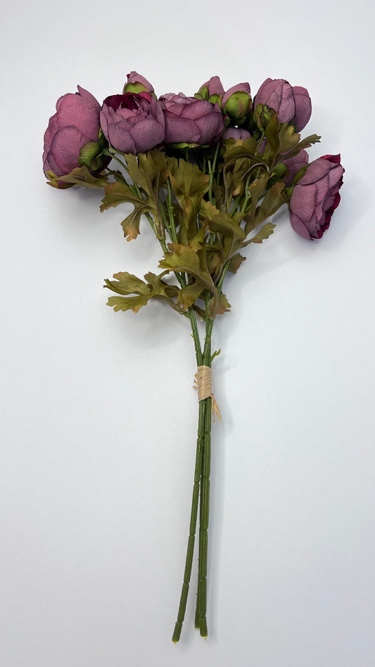 Full-length burgundy ranunculus bundle showing stem length, binding detail, and natural leaf structure for floral design work