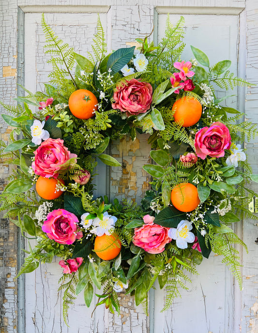 Valencia Gardens botanical citrus front door wreath with realistic Valencia oranges, ranunculus flowers, and botanical greenery for garden inspired front door styling