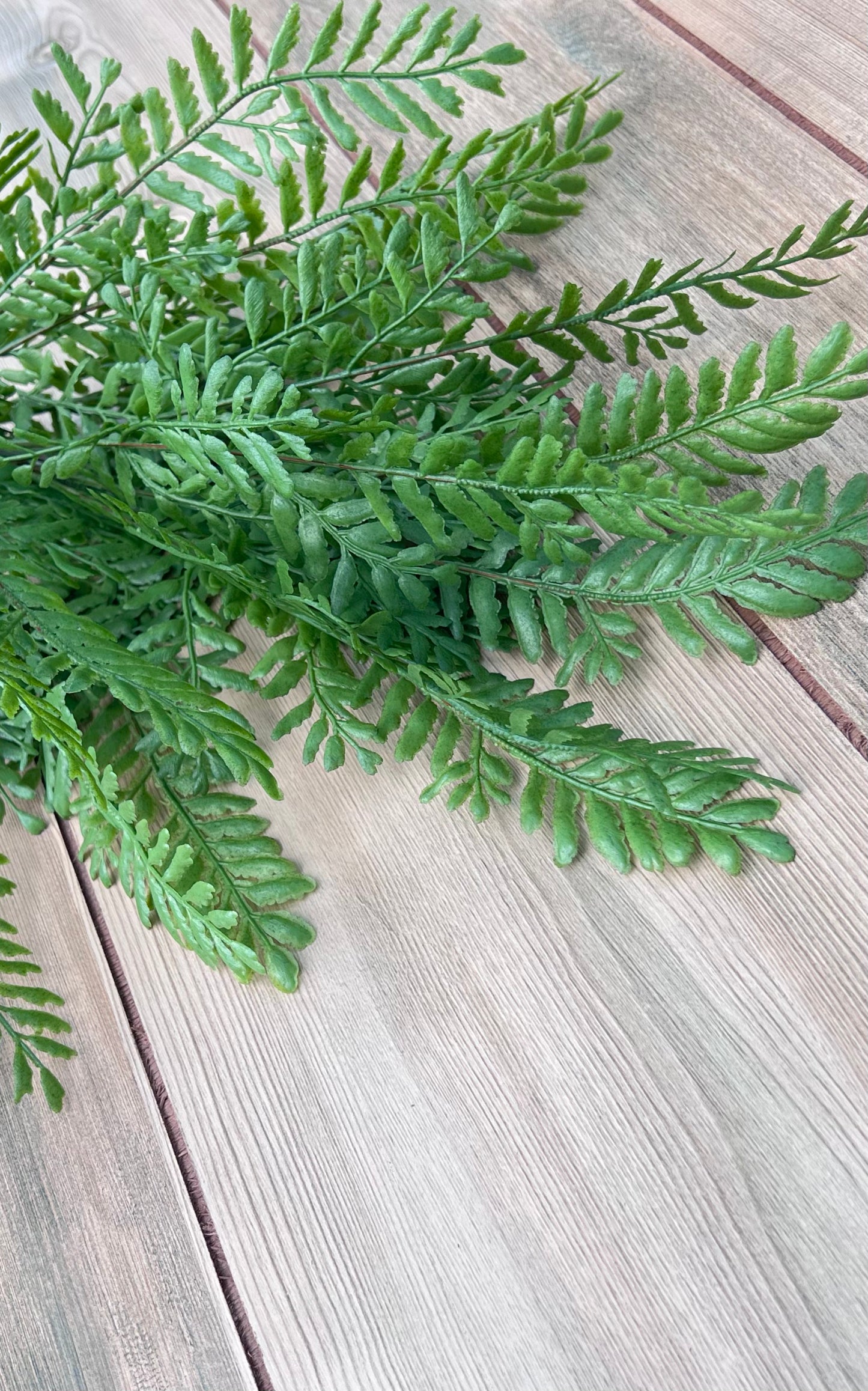 Persian Leaves Bush faux greenery with layered directional foliage sourced by Gardenbug Designs