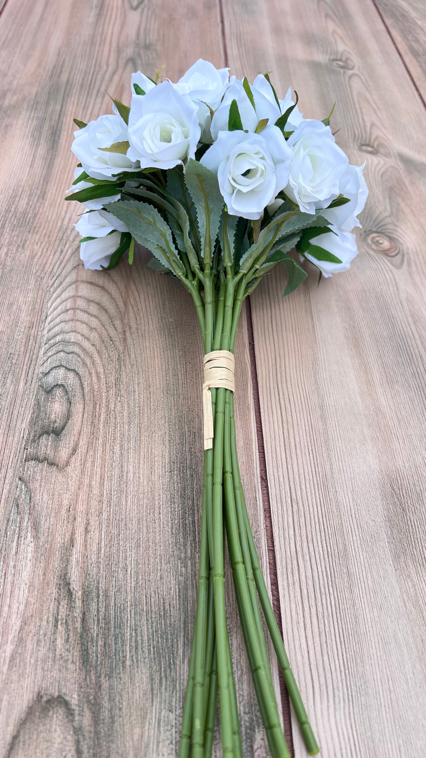 White Rose Bundle showing full floral bundle construction with multiple rose blooms and greenery accents
