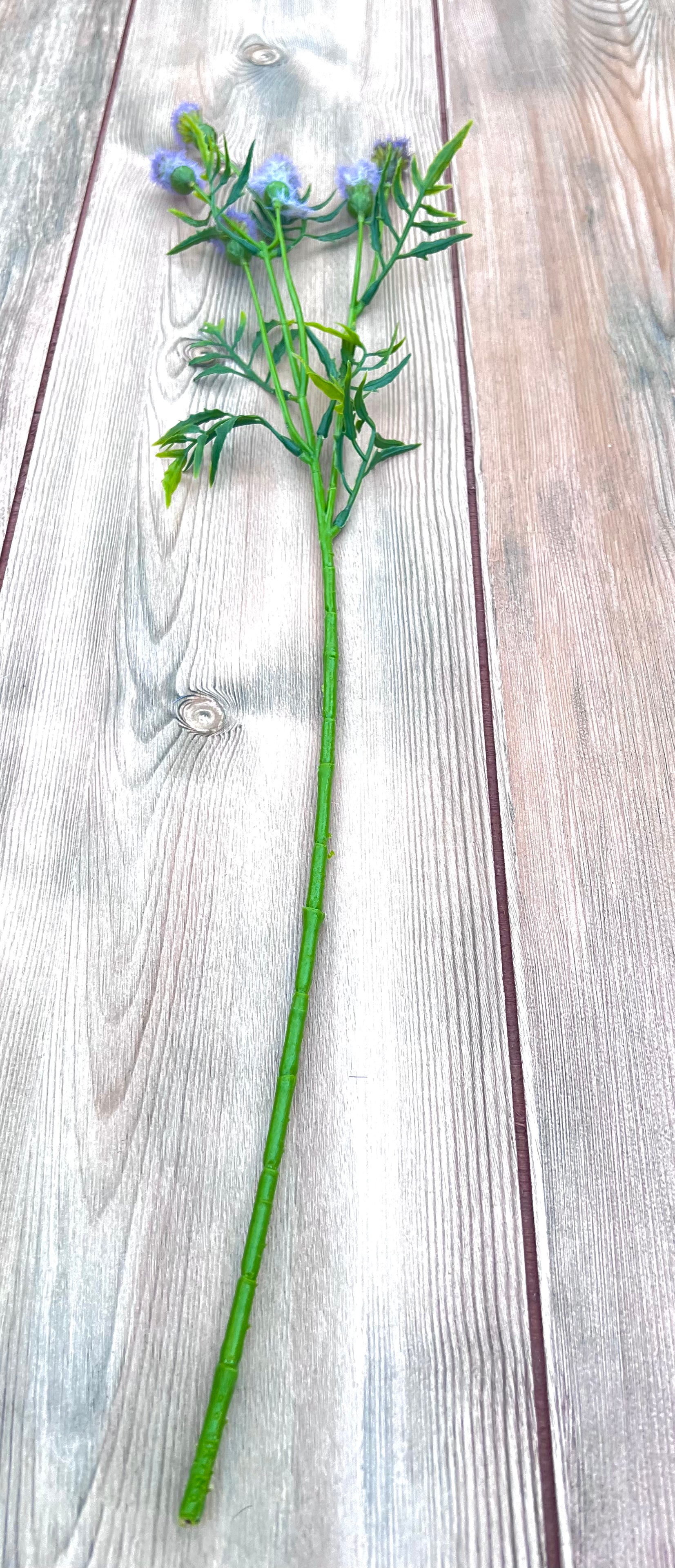 Full view of our Purple Meadow Pod Spray featuring six lavender tufted pods on a faux floral stem