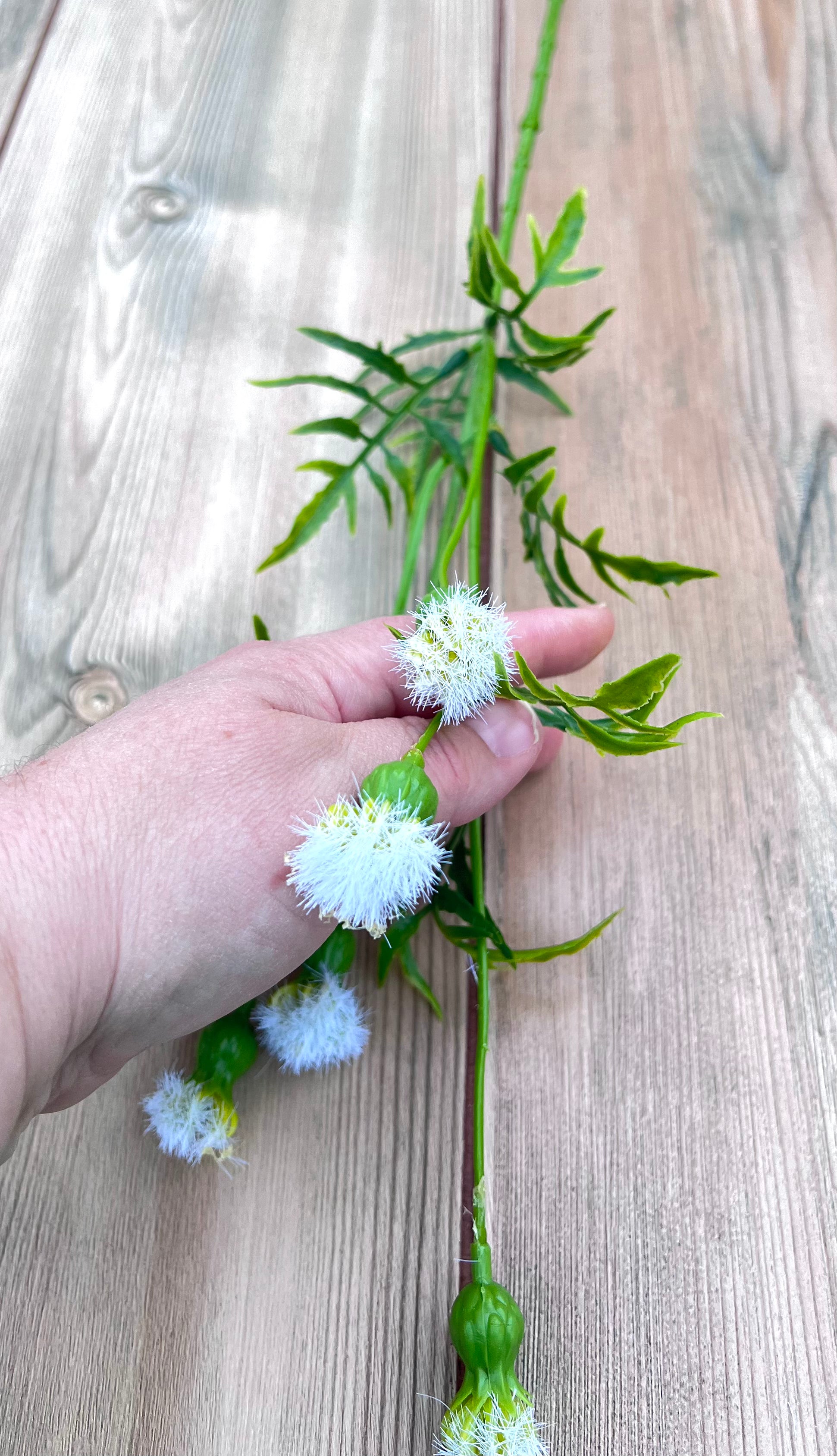 Cream Meadow Pod Spray shown in hand to demonstrate scale for sizing reference