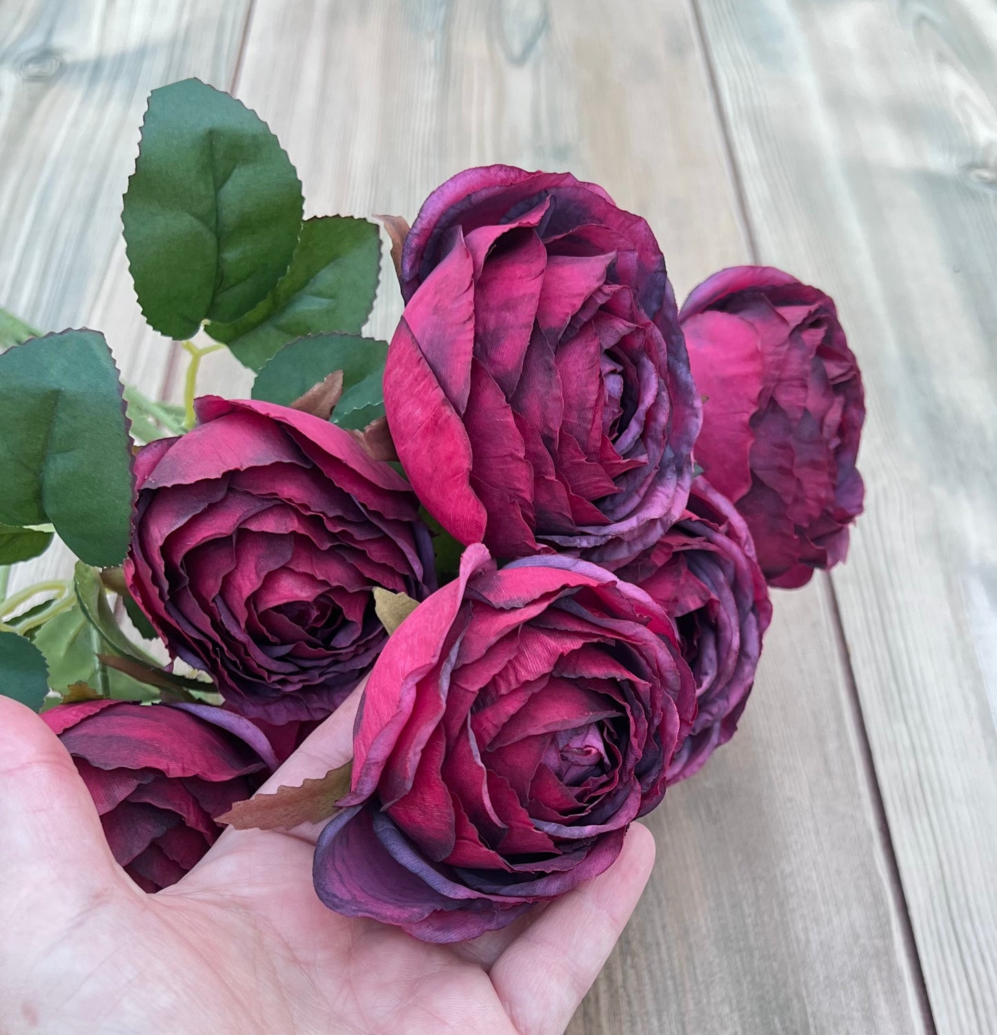 Artificial Raspberry Plum cabbage rose bush shown for size and scale reference