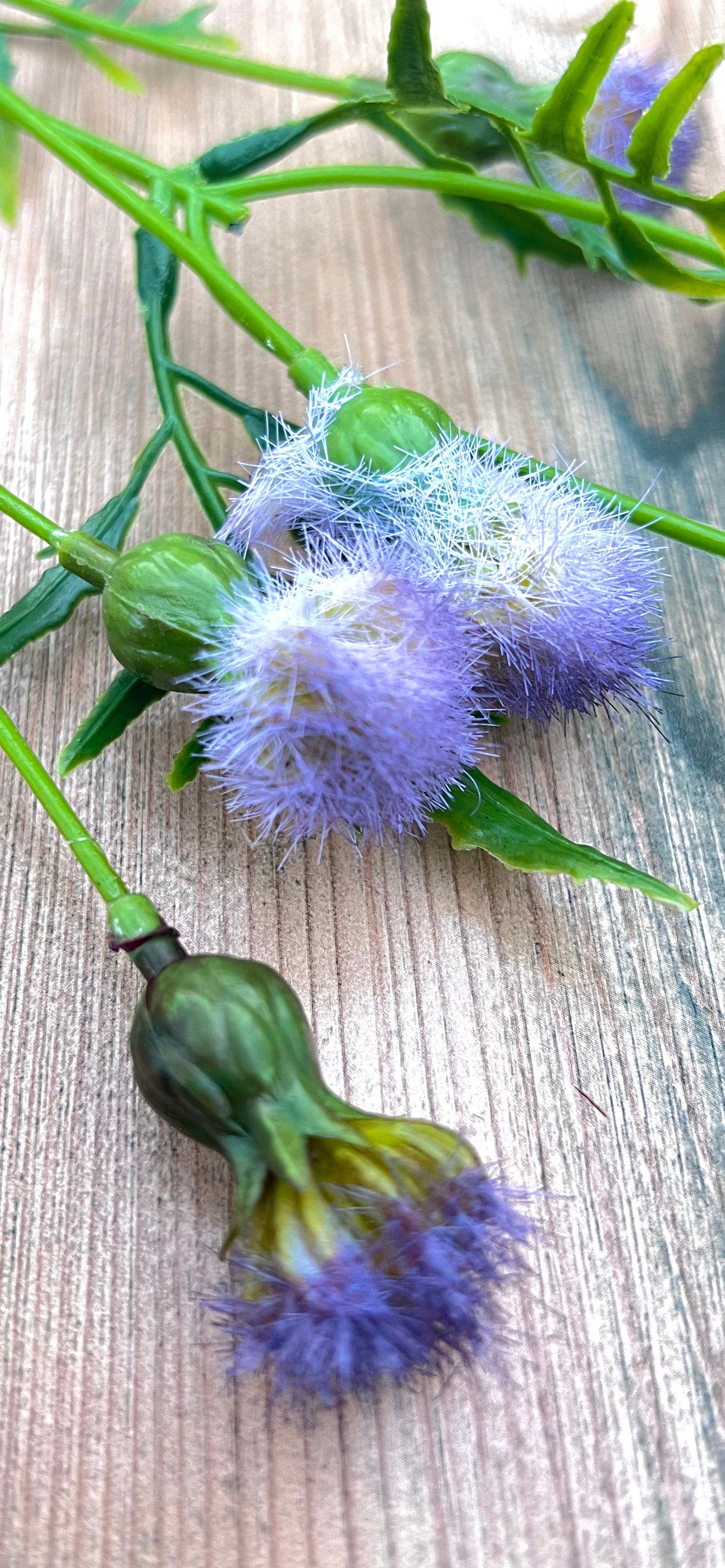 Close up detail of lavender meadow pods on the Purple Meadow Pod Spray