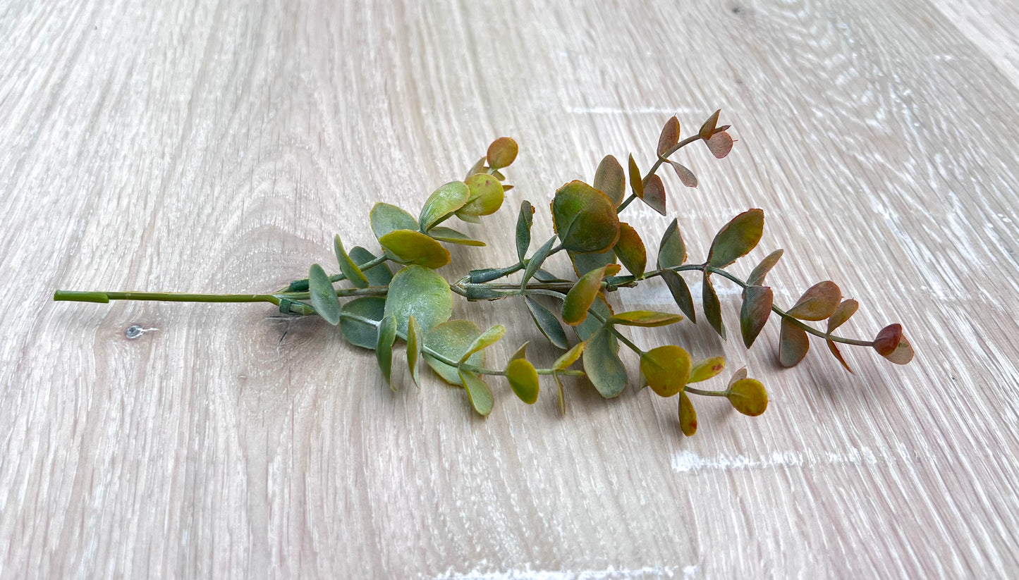 Single stem from Bronze Tips artificial eucalyptus bush showing leaf spacing and construction details