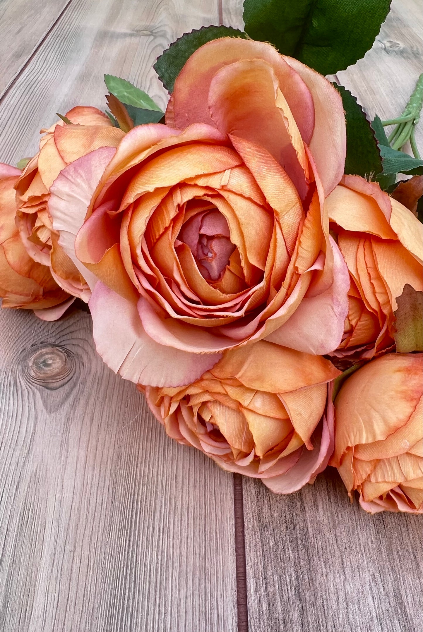 Color detail showcasing the warm sunset-inspired blend of peach, apricot, coral, and rust tones
