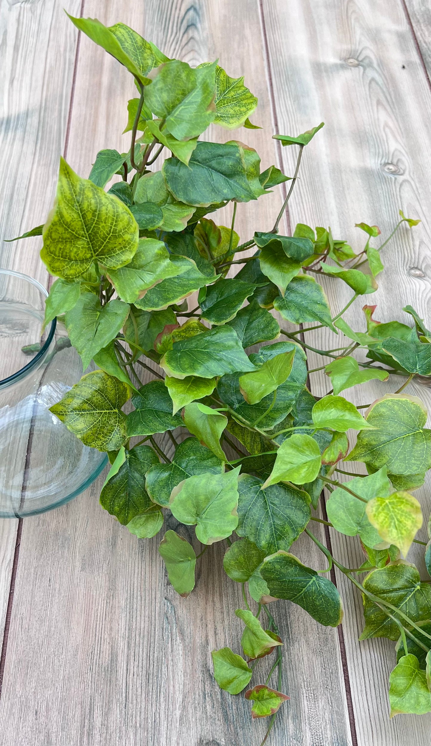 Designer's view of our Cottonwood Ivy Bush in Light Green demonstrating how the material reads within floral design work