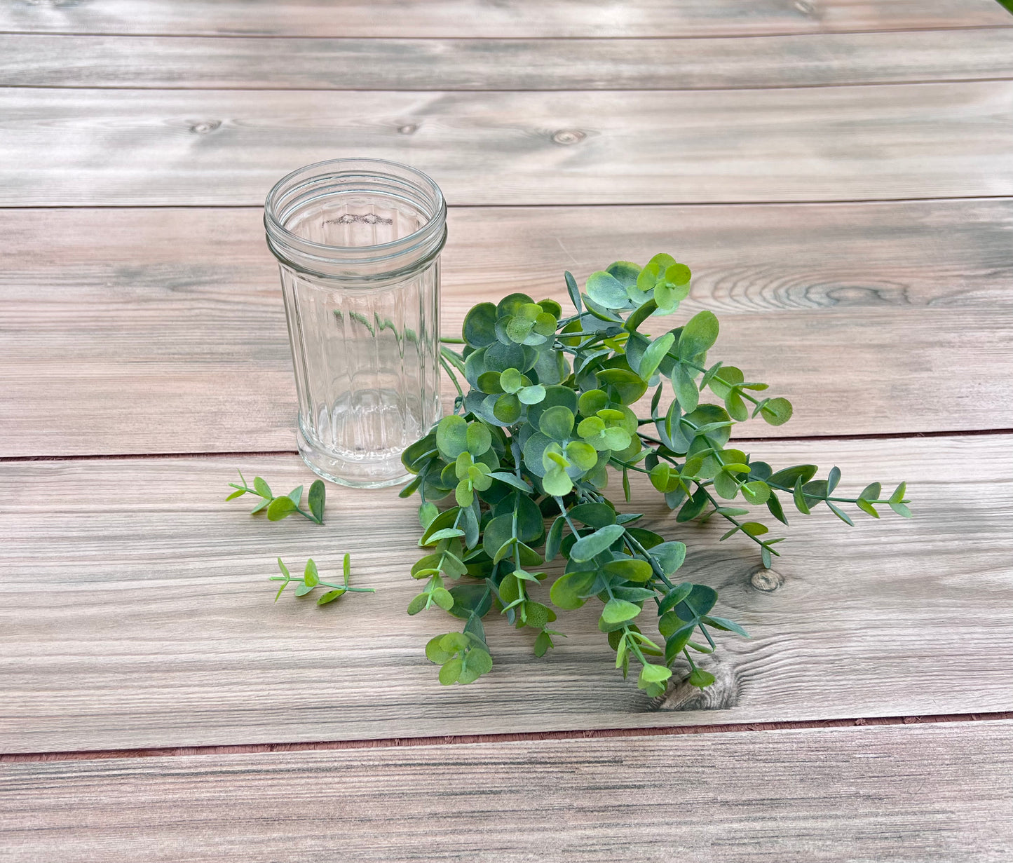 Our faux Eucalyptus Bush | Spring Green paired with a glass vase for floral design inspiration