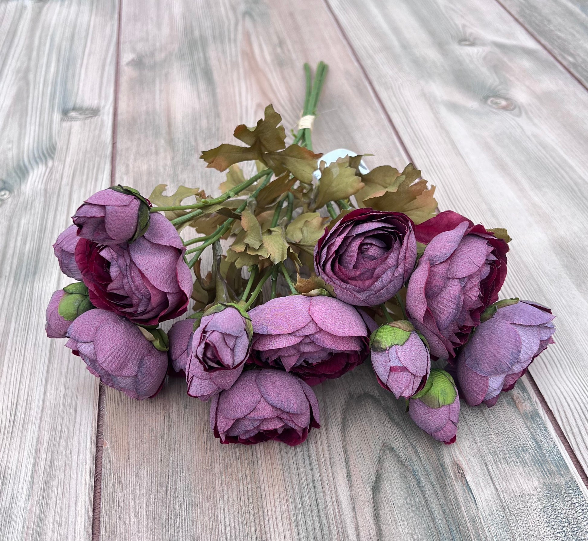 Full-length Ranunculus Bundle in Burgundy showing stem length, binding detail, and natural leaf structure for floral design work