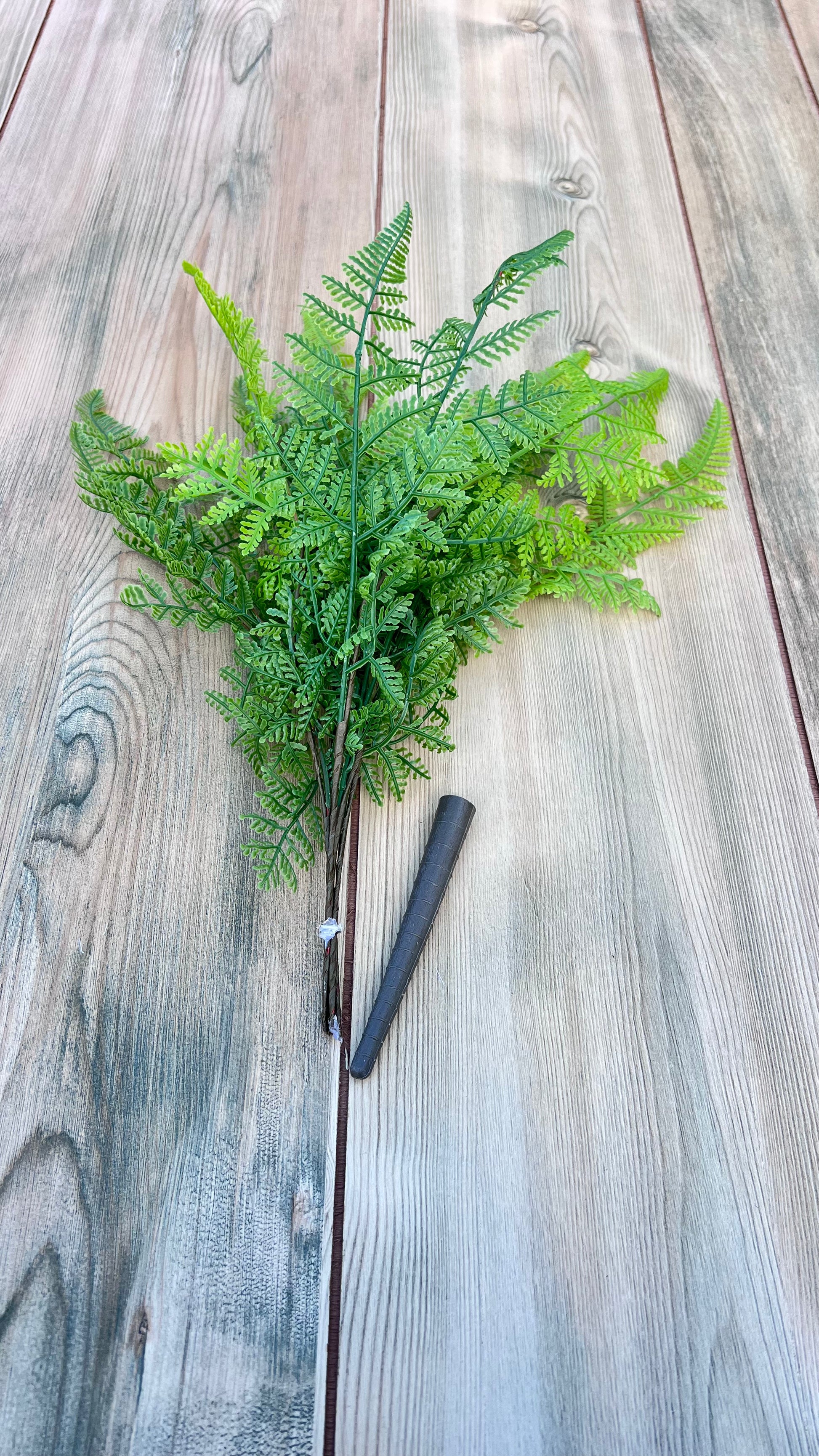 Structural view of the Leather Leaf Fern bundle with cap removed showing bundled appearance, stem placement, and overall construction