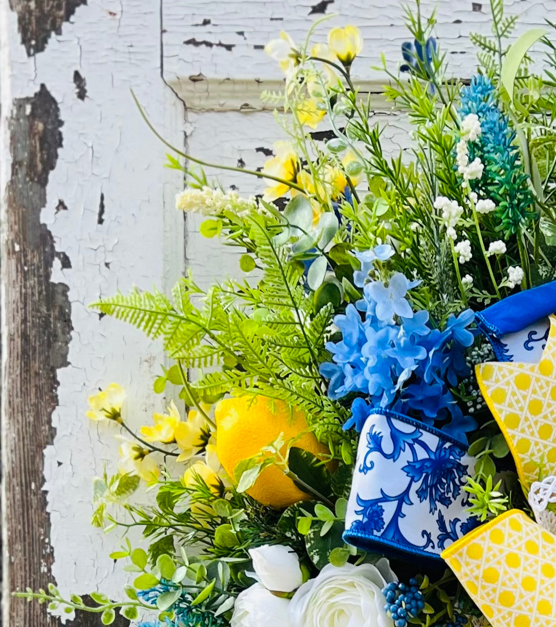 Leather Leaf Fern used in a floral design to create layered fullness, soft transitions, and visual connection between neighboring materials. Fiore di Limone swag created by Gardenbug Designs 