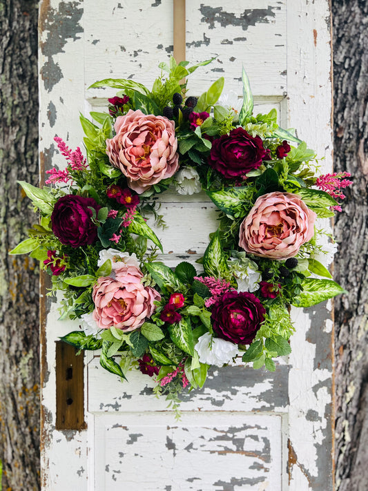 Handcrafted Blackberry Bourbon floral wreath with peonies, ranunculus, lush greenery, and blackberry accents for elegant year round front door decor by Gardenbug Designs.