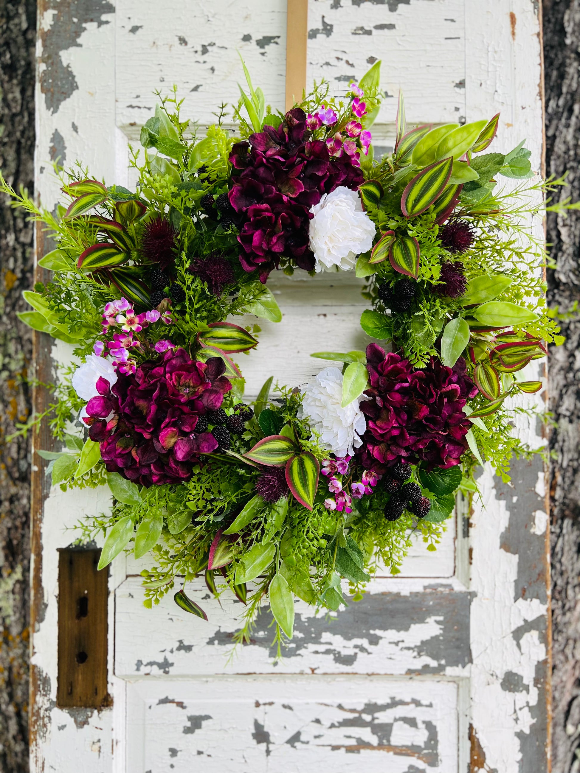 Handcrafted Blackberry Mint Botanical wreath with hydrangeas, peonies, blackberries, and greenery for spring and summer front door decor by Gardenbug Designs.