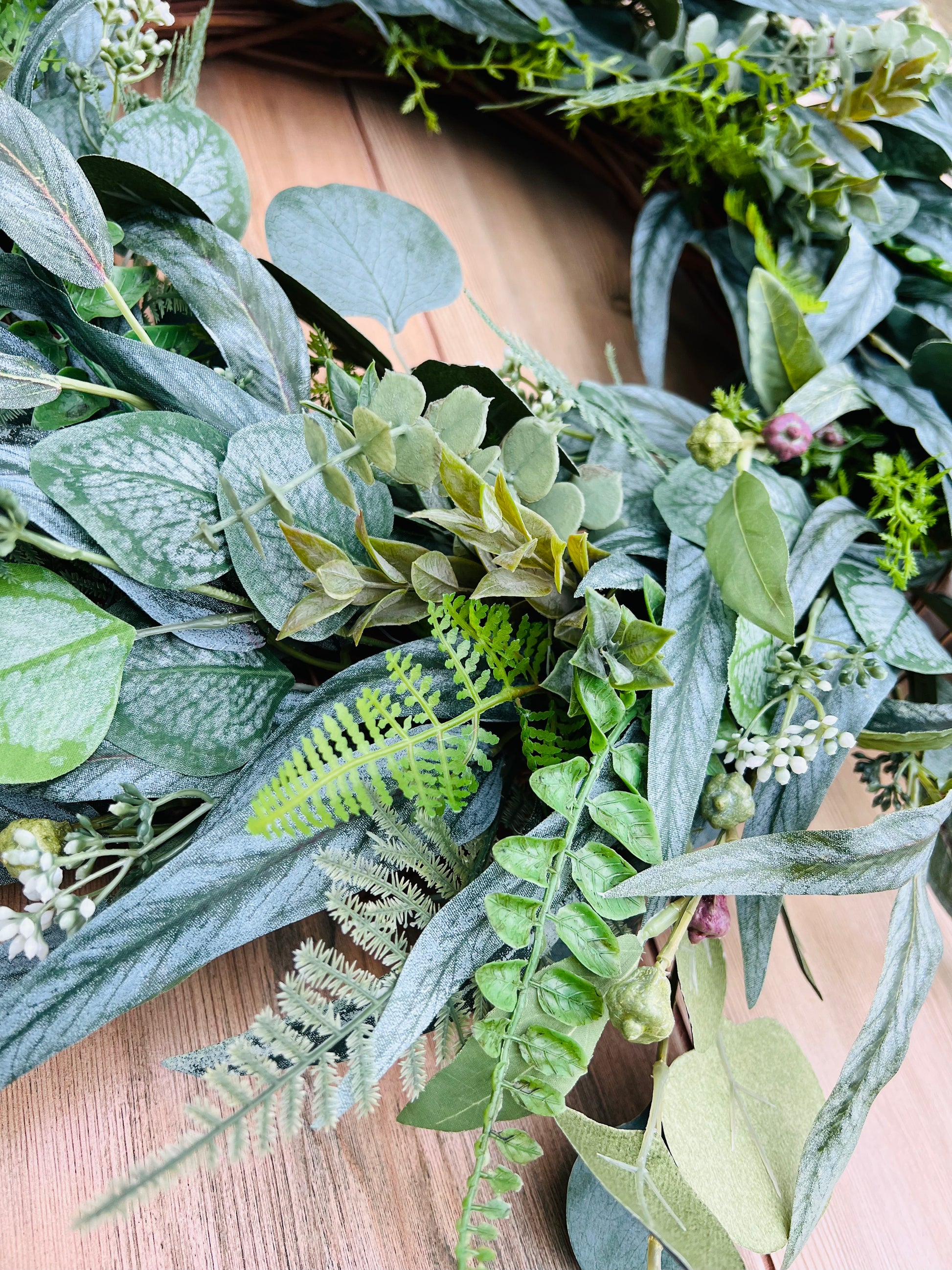 Hartley botanical greenery wreath close up highlighting layered foliage, realistic botanical texture, and detailed craftsmanship | Gardenbug Designs