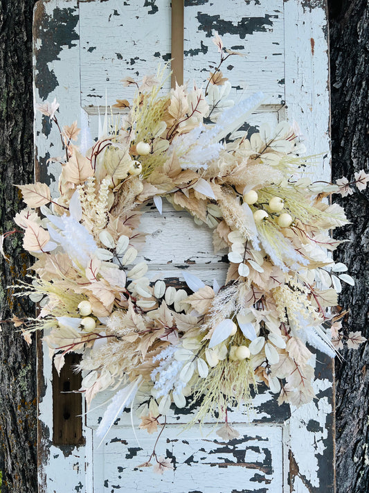 Handcrafted Moon Child Botanical wreath with neutral pampas, cream botanicals, and soft textures by Gardenbug Designs.