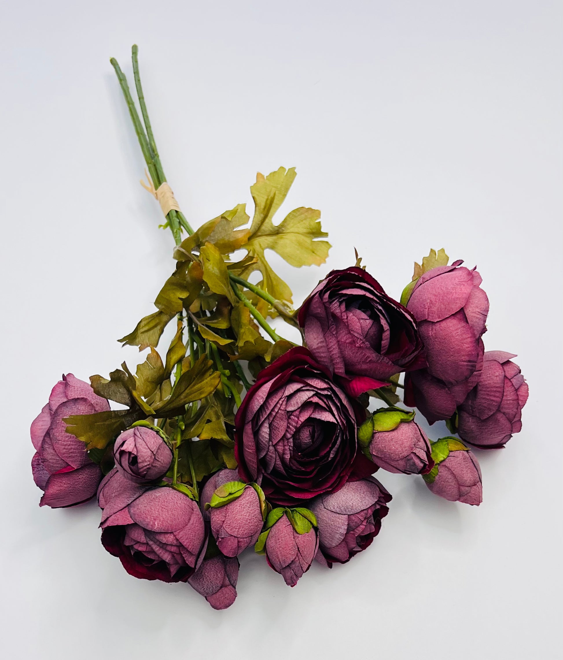 Full burgundy ranunculus bundle with visible stem length and naturally layered blooms, suited for wreath and seasonal arrangements